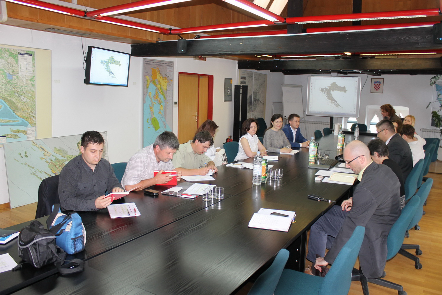 The picture shows the members of the Moldovan delegation visiting one of the institutions that successfully and attractively presented their achievements in the field of NSDI.